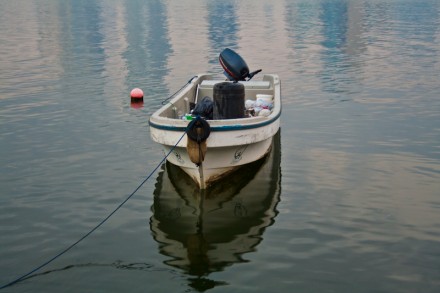 Tethered to the shore, this boat is used to pick up garbage floating in the lagoon by the Sharjah Corniche
