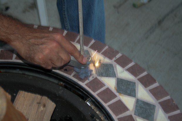 Here I'm using a flint to throw sparks onto the dryer lint